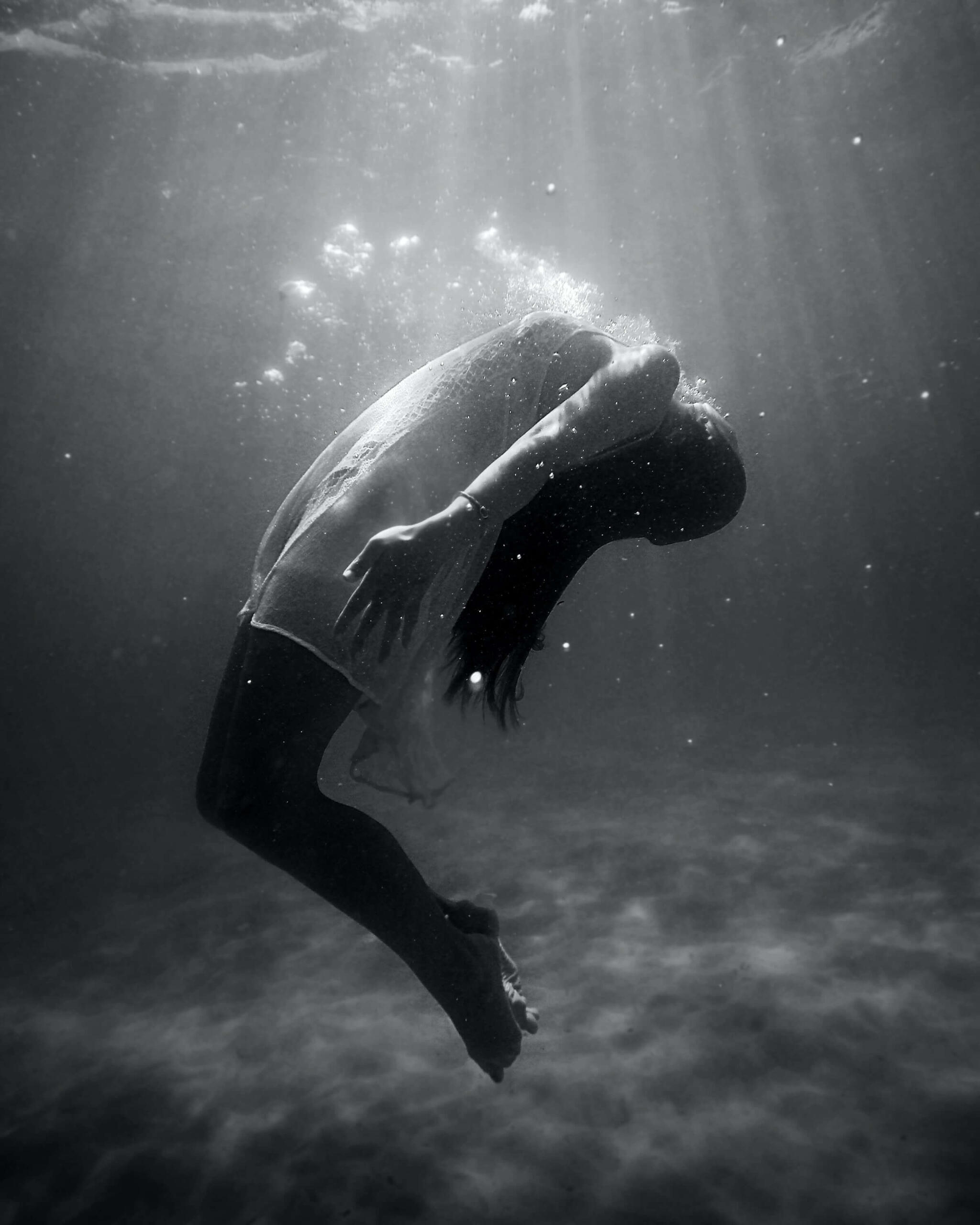 Shadow work This is a photo of a woman floating under water